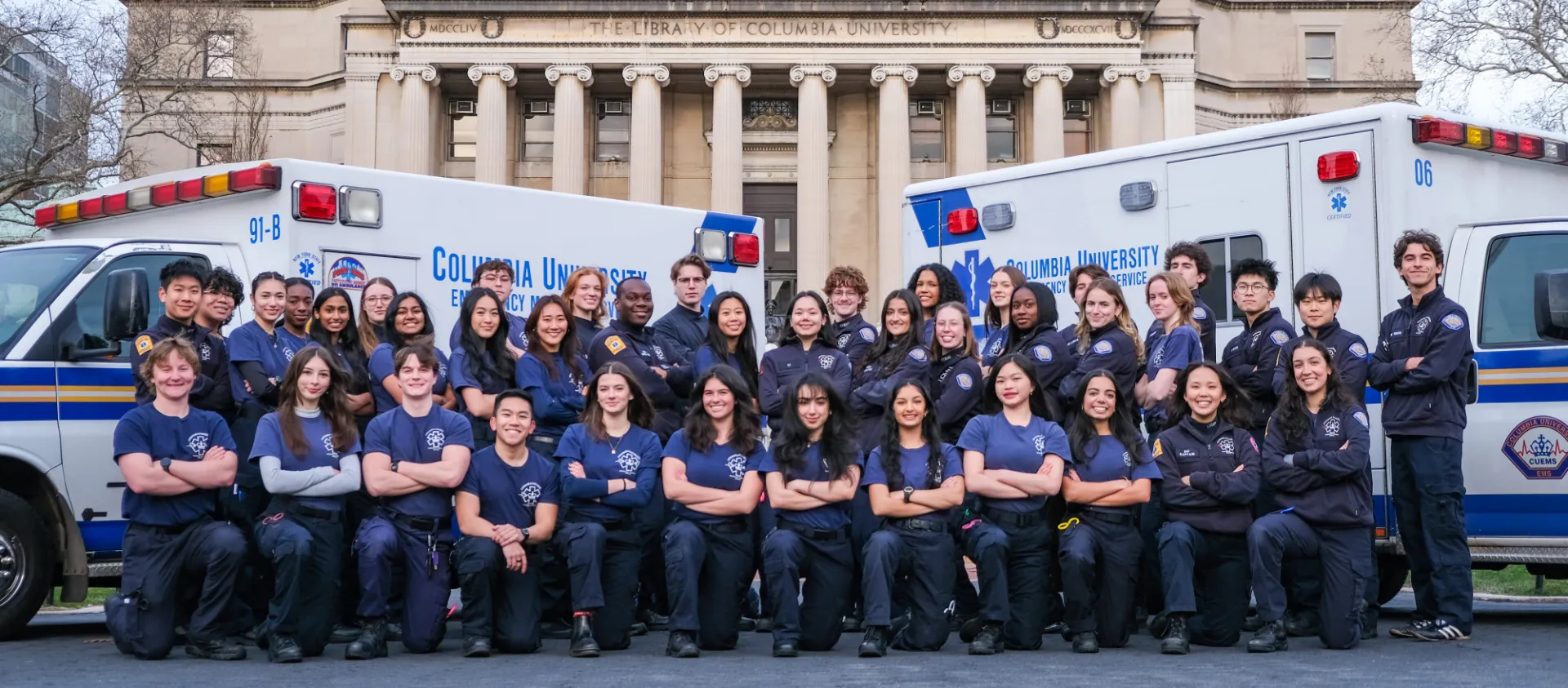 Picture of CUEMS members posing in front of ambulance.